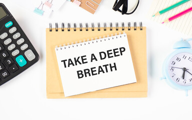 Take a deep breath words on a card in a notebook