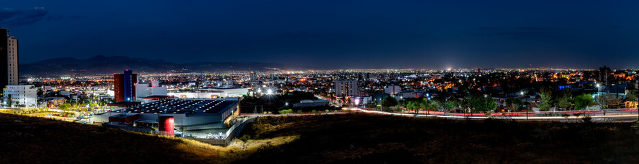 Fototapeta na wymiar Night panorama of the city of León, Guanajuato, Mexico. Urban concept.