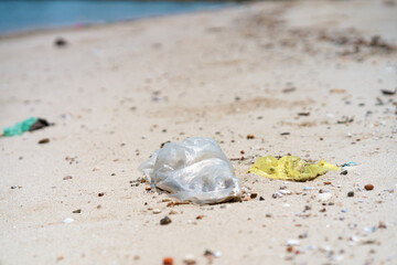 Trash on the sandy beach left by vacationers