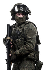 Male soldier in masking camo (green) suit. Shot in studio. Isolated on white background.