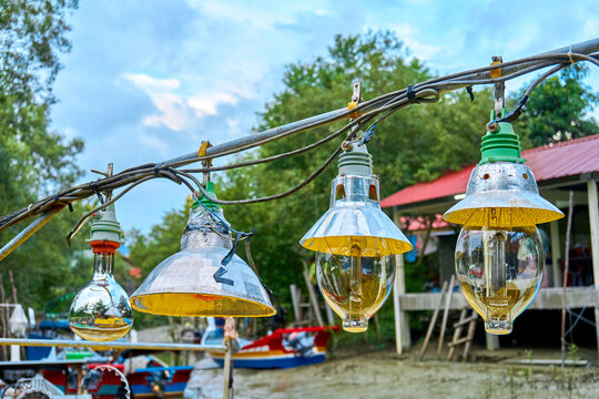 Lighting lamps on an old small fishing boat. - Powered by Adobe