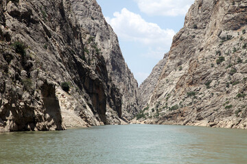Fototapeta na wymiar Dark Canyon River at Kemaliye (Egin) in Erzincan, Turkey. Kemaliye is extreme sport center in Eastern Turkey.