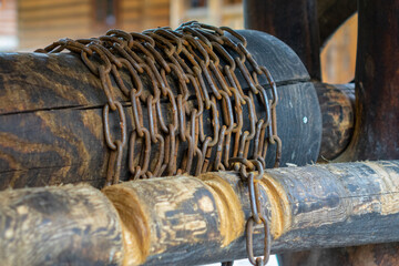 detail of a rusty chain on a well