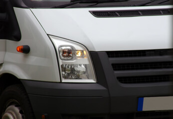 Obraz na płótnie Canvas big white bus close up. car headlight