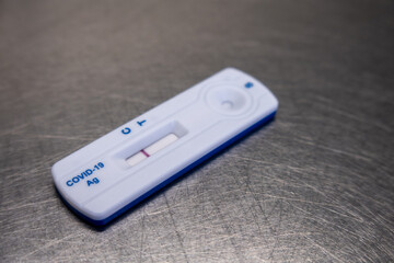  negative Covid test lies on a silver table