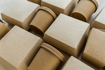 Closeup of kraft paper or eco-friendly packages on wooden background.