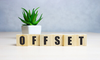 Word offset. Wooden small cubes with letters isolated on white background with copy space...