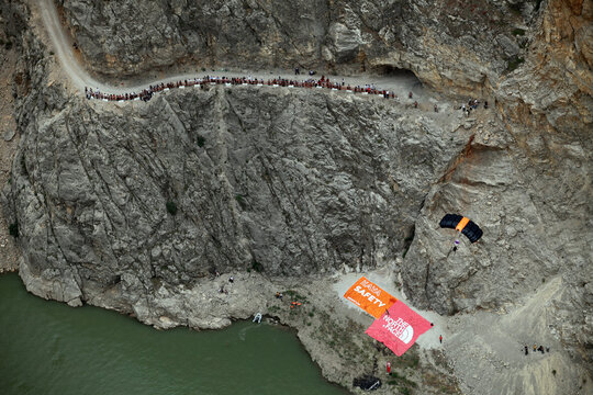 KEMALIYE, TURKEY - JUNE 23: Base Jump after paragliding on the Dark Canyon in district of Kemaliye (Egin) on June 23, 2012 in Erzincan, Turkey. Kemaliye is extreme sport center in Eastern Turkey.