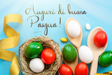 Happy Easter holiday text in italian  card, Easter eggs as the color of the Italian flag - green, white, red	
