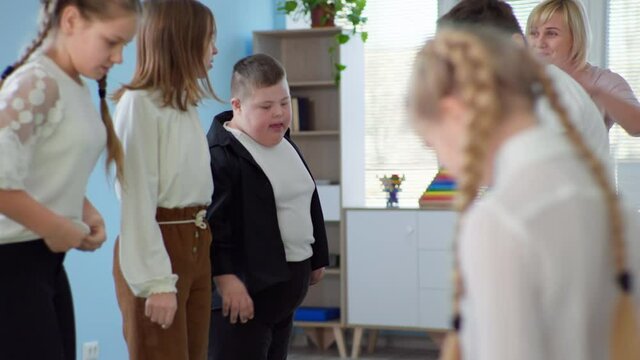 developmental therapy for children with disabilities, happy children jumping rope with boy with down syndrome