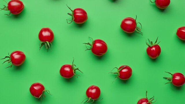 tomato lines move in different directions on a green background, top view. stop motion animation