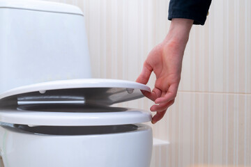 hand open the toilet lid, home household sanitary