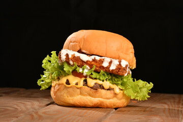 A hamburger (also burger for short) is a sandwich consisting of one or more cooked patties of ground meat, usually beef, placed inside a sliced bread roll or bun.
