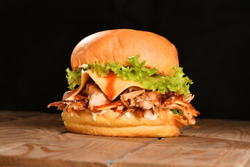 A hamburger (also burger for short) is a sandwich consisting of one or more cooked patties of ground meat, usually beef, placed inside a sliced bread roll or bun.
