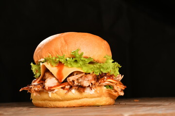 A hamburger (also burger for short) is a sandwich consisting of one or more cooked patties of ground meat, usually beef, placed inside a sliced bread roll or bun.
