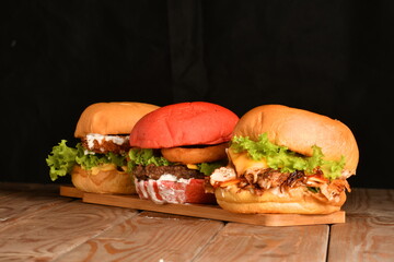 A hamburger (also burger for short) is a sandwich consisting of one or more cooked patties of ground meat, usually beef, placed inside a sliced bread roll or bun.
