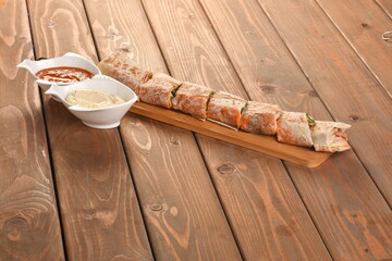 A hamburger (also burger for short) is a sandwich consisting of one or more cooked patties of ground meat, usually beef, placed inside a sliced bread roll or bun.
