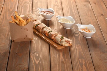 A hamburger (also burger for short) is a sandwich consisting of one or more cooked patties of ground meat, usually beef, placed inside a sliced bread roll or bun.
