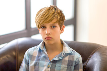 Fototapeta premium Closeup portrait of teenage boy. Photo session in the studio