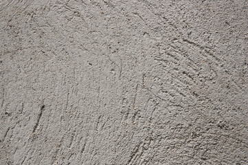 Closeup of a cracked gray concrete wall