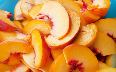   Close-ups of ripe peach slices. Orange slices of juicy peaches.