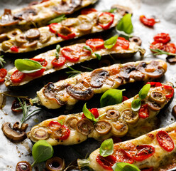 Baked zucchini with cheese and vegetable filling, close-up view