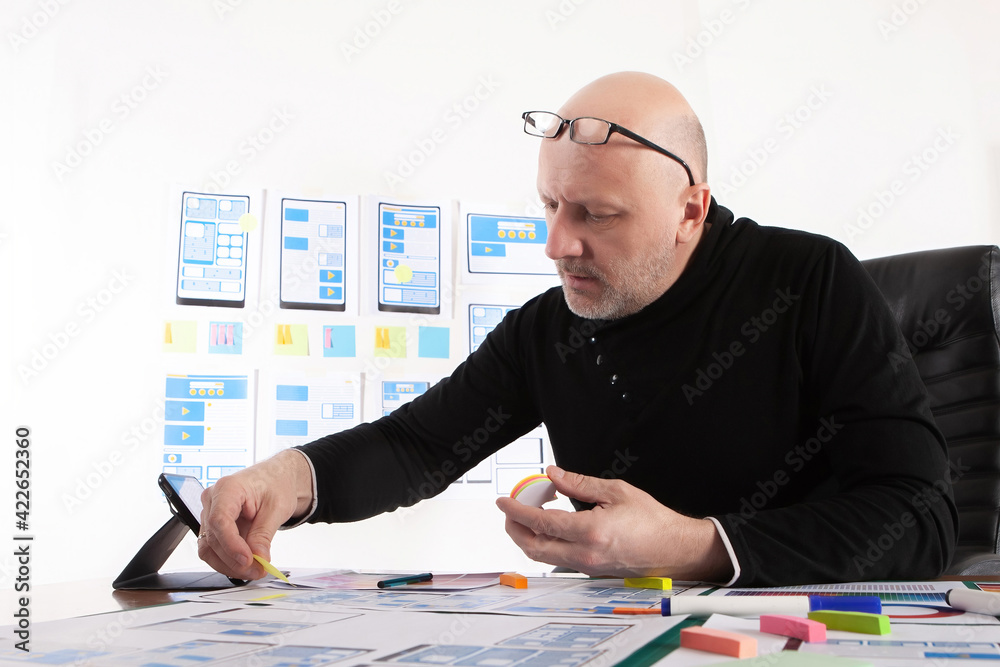 Poster social network app development. man mobile app developer. designer is working on layout of applicati