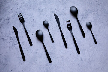 black cutlery on a marble table - 422652970