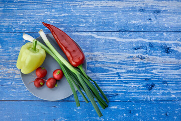 fresh seasonal vegetables on a plate - 422653547
