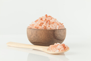 Pink salt from the Himalayas; photo on white background.