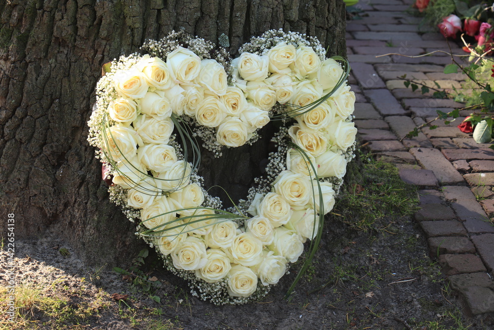 Wall mural heart shaped sympathy flower arrangement, white roses