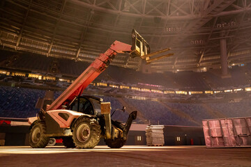 Lifting machine inside stadium. Special technique for stage editing. Machine with a crane. Concept...