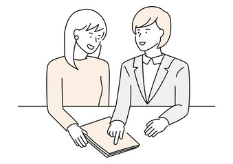 書類を見て相談をするスーツ姿と私服の女性
