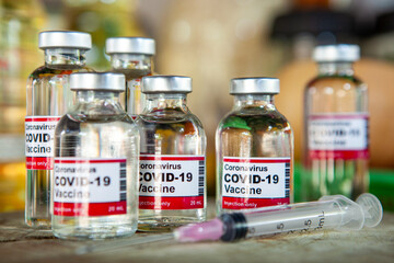 VacCovid-19 drug vaccine vials medicine bottles syringe injection. Medicine infectious concept.
