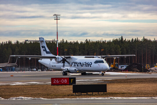 Tallinn, Estonia - March 23, 2021: finnair plane ATR 72-500 (OH-ATE) takes off from Airport of Tallinn