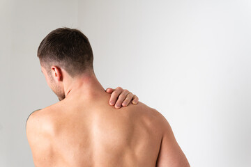 Naklejka premium The muscles of the neck in a man on a white background are hurt ache sore injury, backache sick man background medical, expression. red sickness, ain suffer attractive