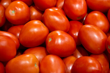 group of red tomatoes on market
