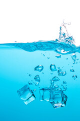 Fototapeta na wymiar Ice cubes falling into the blue water create beautiful bubbles.