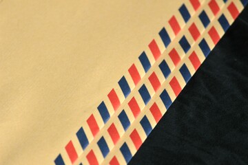 Fototapeta na wymiar brown envelope for paper documents with a beautiful striped pattern.