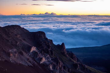 Fototapeta na wymiar Early Morning Sunrise on top of the Volcano at Haleakala National Park, Maui, Hawaii, United States