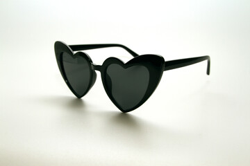 Heart shape sunglasses on white