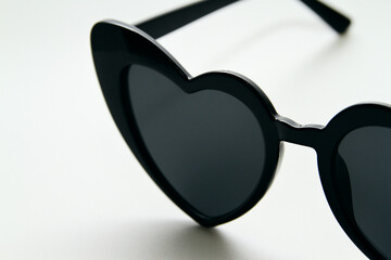 Heart shape sunglasses on white