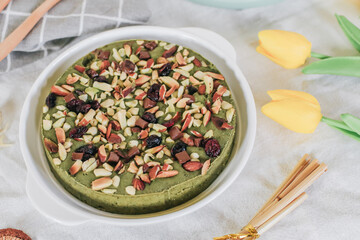 Healthy green tea brownie with almonds On Wooden Table With Copy Space. Delicious homemade.