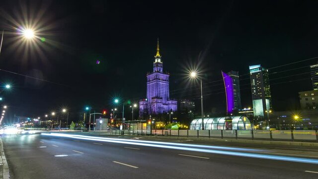 Warsaw night motion timelapse in city centre. View to the science palace at nigth, traffic lights, city life 