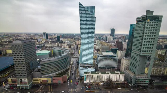 Warszawa, Warsaw timelapse in business quarter. Financial centre. View to the skyscrapers from the famous science palace. A lot of cars and people around, cloudy day.