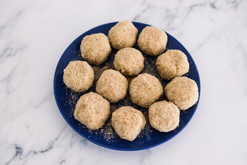 vegan arancini risotto balls about to get fried, healthy plant-based food