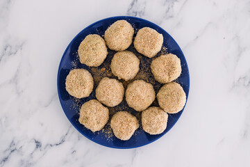 vegan arancini risotto balls about to get fried, healthy plant-based food