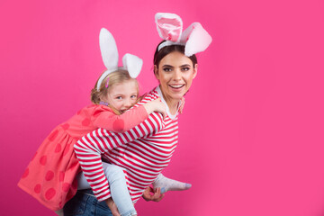 Happy easter. Two sisters hunting for Easter eggs. Girls with bunny ears.