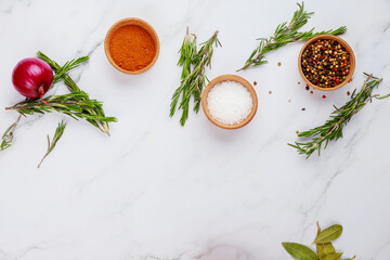 Various herbs and spices on white background.