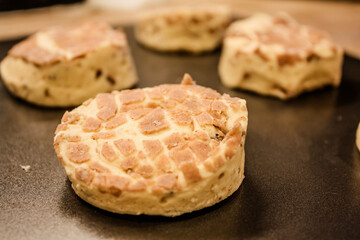 Delicious uncooked cinnamon roll on a pan waiting to be cooked
